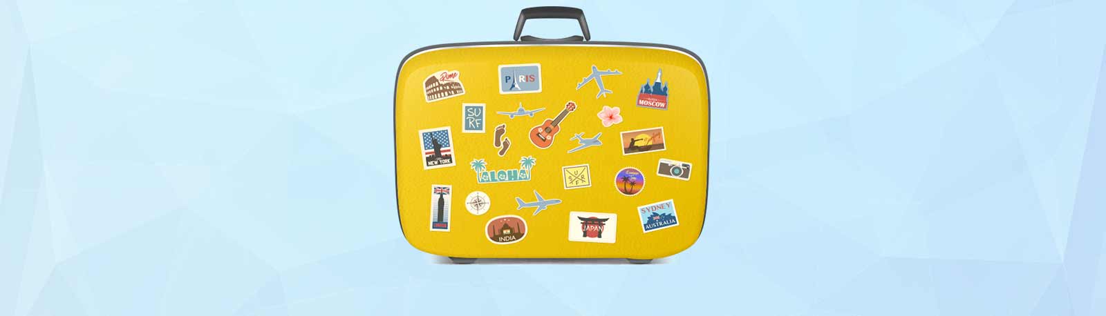 Gul rejsekuffert med klistermærker